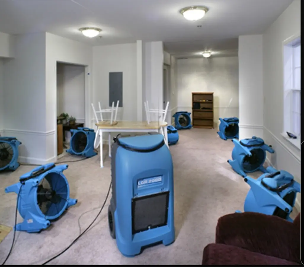 Air movers and dehumidifier setup for Water Damage Restoration in Rockaway